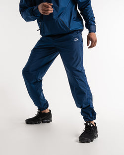 Man in a navy sauna suit tracksuit with a white boxraw logo on the chest as well as adjustable wrist straps and made from polyester.